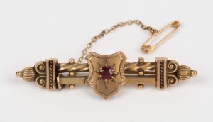 WILLIS & SONS of Melbourne, 9ct gold bar brooch with shield and red stone, 19th century, stamped "W.9." with pictorial marks, 6cm wide, 3.8 grams