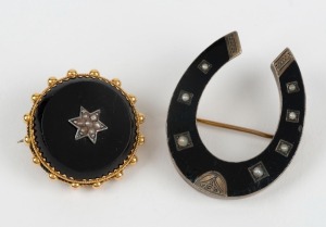 Two antique brooches. One 9ct gold and black enamel horseshoe shaped with seed pearls. The other 9ct gold and black onyx with seed pearls set in a star pattern, 19th century, the larger 3.8cm high