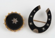 Two antique brooches. One 9ct gold and black enamel horseshoe shaped with seed pearls. The other 9ct gold and black onyx with seed pearls set in a star pattern, 19th century, ​​​​​​​the larger 3.8cm high