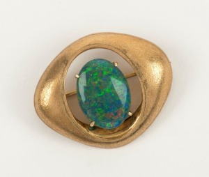 A vintage 9ct yellow gold and opal brooch, circa 1970s, stamped "9k", ​​​​​​​3.3cm wide, 6.9 grams