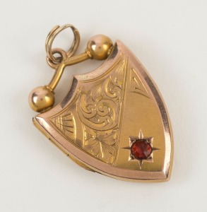 ARONSON & Co. of Melbourne, 9ct yellow gold shield shaped locket with red stone, stamped "9" flanked by pictorial marks, 2.5cm high, 4.6 grams total