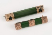 Two antique New Zealand greenstone bar brooches, both mounted in 9ct yellow gold, 19th century, the larger ​​​​​​​5cm wide