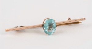 An antique 9ct gold and blue topaz bar brooch, circa 1900, 4.7cm wide, 1.7 grams