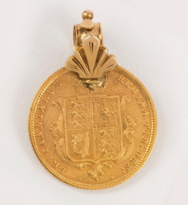 An 1883 half sovereign (22ct), with antique 15ct gold loop mount, 2.6cm high overall, 4.9 grams total