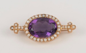 An antique yellow gold brooch set with a large amethyst surrounded by seed pearls, 19th century, 4.2cm wide, 7.6 grams total