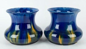 McHUGH pair of mantel vases glazed in blue with yellow highlights, incised "H. McHugh, Tasmania, 18", 18cm high, 22cm wide