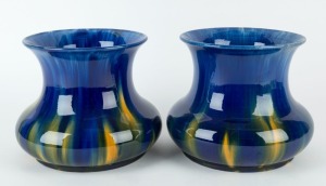 McHUGH pair of mantel vases glazed in blue with yellow highlights, incised "H. McHugh, Tasmania, 18", ​​​​​​​18cm high, 22cm wide