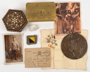 WW1 "DEATH PENNY" for GEORGE HENRY WOODHOUSE, together with a small accumulation of WW1 items including a 1914 Christmas tin, a Field Service Post Card, a real photo military portrait postcard, a carved mother of pearl rising sun brooch, A Syrian trinket 