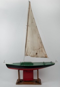An vintage pond yacht on stand, early to mid 20th century, 145cm high on stand, 105cm long