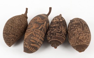 Four carved boab nuts, one signed "A. GEORGE", 20th century, the largest 20cm high overall