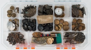 An accumulation of Australian Commonwealth Military Forces "Rising Sun" badges, various buttons, insignia, "dog" tags, collar pins, etc. Great opportunity.