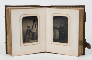 TINTYPE PHOTOGRAPHS: a collection of portraits in an ornate antique leather-bound album with brass clasps, circa 1860s. (50 images).