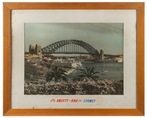 [AIRLINE ADVERTISING] A large format photograph of Sydney Harbour Bridge (with Luna Park in the foreground), mounted above a hand-painted label reading "fly ANSETT - ANA to SYDNEY", circa 1960, framed and 68 x 83cm overall.