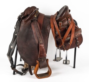 R.M. WILLIAMS "GOOSENECK POLEY" vintage Australian stock saddle with R.M. WILLIAMS saddle bags adorned with silver conchos and buckles, stamped in numerous places, accompanied by a fine breast plate and accessories including a stand.