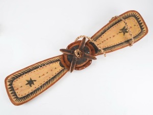 EDWARD SALLE (born c.1939, Madar People, Tabar Islands, New Ireland Province, Papua New Guinea), A finely painted wooden Malagan ornament, with suspension "rope". Wood, shell, fibre, lime, and natural red, black and yellow pigments, circa 1990s. 80cm long