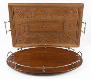 An Australian solid blackwood oval tray with nickel plated gallery; together with an Indian timber tray carved with grapes and leaves, 19th/20th century, (2 items), ​​​​​​​56cm and 67cm across the handles