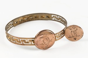 An antique adjustable gold plated bangle with kookaburra plaque, together with a matching brooch, circa 1900, (2 items), the brooch 2cm diameter