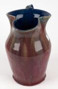 REMUED early pottery jug with lustrous pink glazed body, green handle and rich blue interior, incised "Remued 54Z", 25cm high - 2