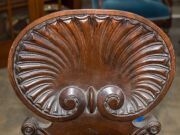 A pair of early Colonial Australian cedar hall chairs with finely carved shell backs and applied roundels, New South Wales origin, circa 1840, 87cm high. ​​​​​​​PROVENANCE: The Windeyer Family, New South Wales. - 10