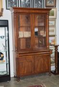 A Colonial Australian cedar bookcase with shield panel doors and turned columns, mid 19th century, 237cm high, 144cm wide, 54cm deep - 2