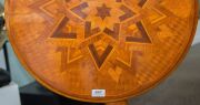 ANTON SEUFFERT (1815-1887) New Zealand, fine and rare tilt-top wine table with mottled Kauri tapering barley twist stem and three scroll legs, radiating starburst marquetry top with lozenge parquetry ground, inlaid with numerous native timbers, circa 1870 - 4