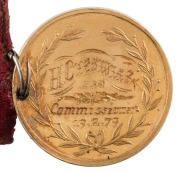 1880 MELBOURNE INTERNATIONAL EXHIBITION, Foundation Stone, commemoration medal in gold (22mm, 8.1g) by (E.Altmann), inscribed on reverse 'H. Creswick Esq. / Commissioner / 19/2/79'  with original button-hole ribbon with button. - 3