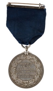 U.S.A.: Fifth Universal Postal Congress Member's Badge, Washington, D.C., 1897. Silver. 37mm. Washington bust right, rev. Six-line legend within wreath including date MDCCCXCVII. Rare. Fancy claw loop. With original ribbon and clasp.