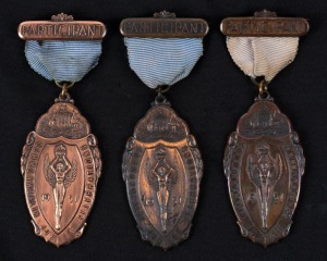 COMMONWEALTH JUBILEE CELEBRATIONS, 1951, in bronze (36x64mm) (C.1951), by Denham, Neal & Treloar, Sydney, ring top suspension with ribbon and brooch bar, 'Participant' to bar. (3 examples).