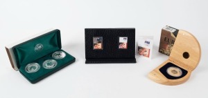 Coins - Australia: Decimal Proofs: SELECTION with Eureka Stockade 150th Anniversary 'Locket Coin' fine silver coin (24gr) incorporating central locket containing small gold nuggets housed in wooden presentation box (Retail $125); Perth Mint 2002, 2003 & 2004 Silver $1 Kookaburra presentation set of three 1oz proofs; also Perth Mint 2008 Beijing Olympics 50c Stamp Coin, 15.55gr of fine silver, in presentation box. (3 items)