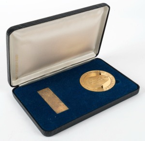 ROYAL AUSTRALIAN MINT: Large gilt medal (57mm) proof-like finish; obv. "GOLD OF THE PHARAOHS - ARAB REPUBLIC OF EGYPT - AUSTRALIA"; rev. "AUSTRALIAN TOUR : BRISBANE-PERTH-SYDNEY-MELBOURNE 1988-1989"; in case of issue with silver panel engraved "Presented to Mr. James Leslie, AO, MC / Chairman / International Cultural / Corporation of Australia".