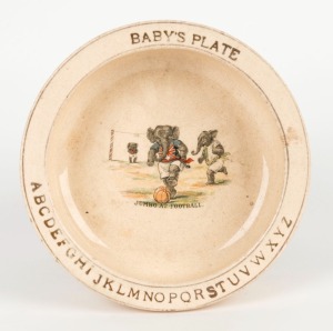"JUMBO AT FOOTBALL Baby's Plate", child's ceramic plate featuring a transfer printed scene of elephants in patriotic jerseys playing football; late 19th early 20th century, 17cm diameter