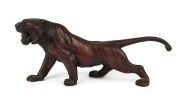 A Japanese bronze tiger statue with glass eyes, Meiji period, early 20th century, seal mark to base, ​​​​​​​15cm high, 32cm long