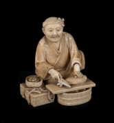 A fine antique Japanese carved ivory statue of a man cleaning fish, Meiji period, black and red seal mark to base, ​​​​​​​10.5cm high