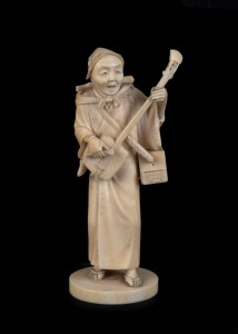 A Japanese carved ivory stature of the musician, Meiji period, two character red seal mark to base, 13.5cm high,