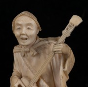 A Japanese carved ivory stature of the musician, Meiji period, two character red seal mark to base, 13.5cm high, - 3