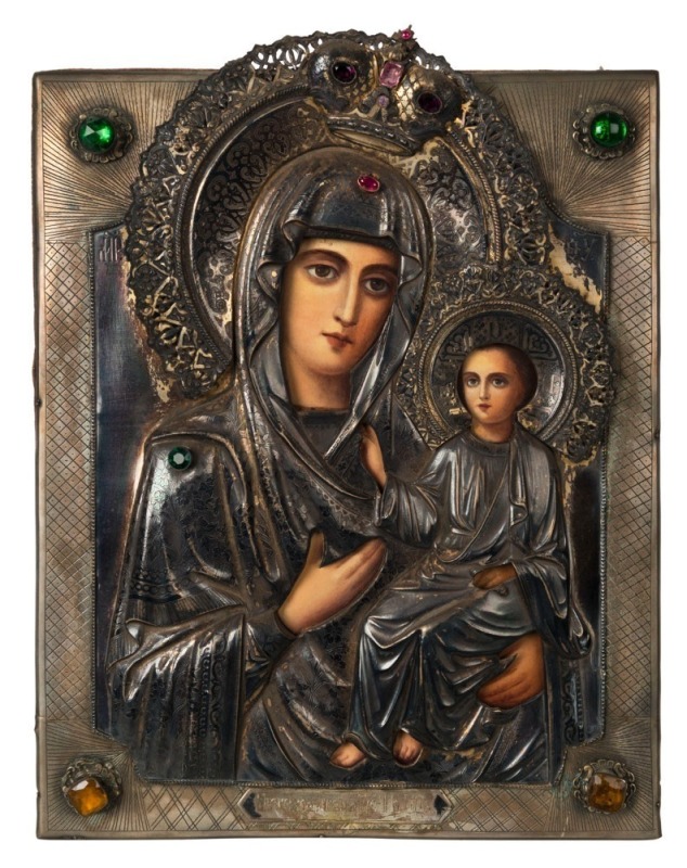 A Russian silver icon of the Mother of God, Shower of the Way, encrusted with coloured rhinestones, 20th century, 31cm x 24cm 