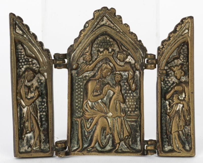 An antique triptych icon depicting the nativity of the Virgin and Child  crowned by angels, cast