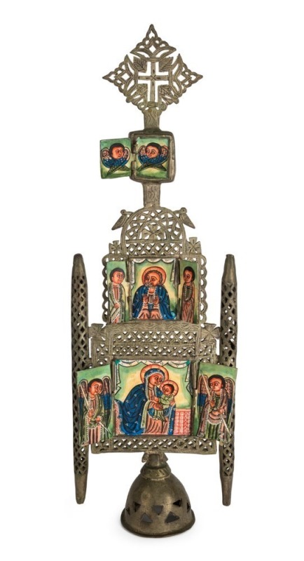 An Ethiopian Orthodox alter piece icon, bronze with silver finish and hand-painted panels depicting the Mother of God and various saints and angels, 19th/20th century, 63cm high overall