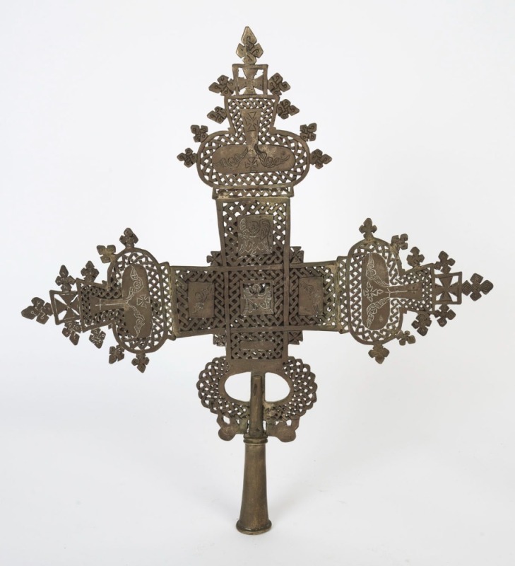 An Ethiopian Orthodox processional cross, bronze with remains of silver finish, 19th/20th century, 51cm high