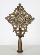 An Ethiopian Orthodox processional cross adorned with bird decoration, bronze with remains of silver finish, 19th/20th century, 25cm high