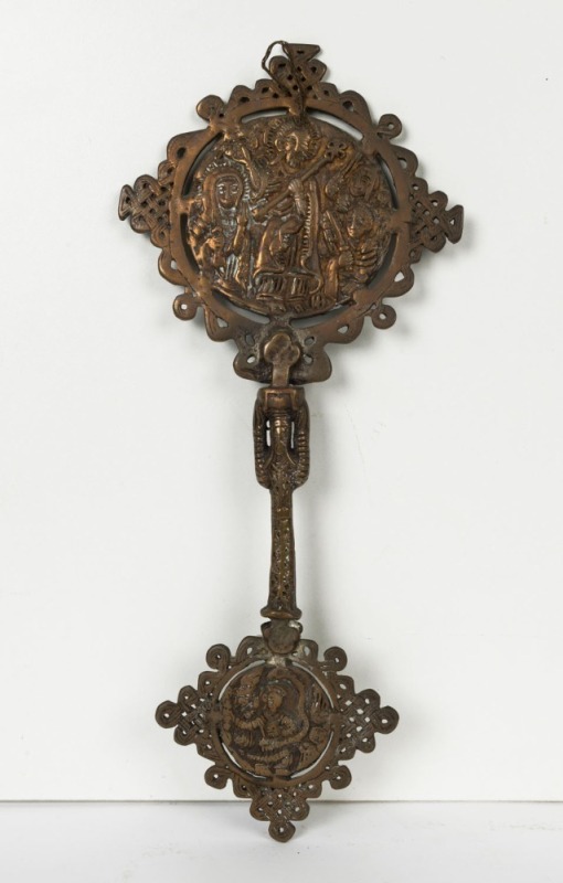 An Ethiopian Orthodox handheld crucifix, cast bronze with remains of silver finish, 19th/20th century, 33cm high