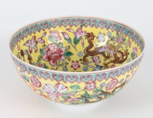 A Chinese eggshell porcelain bowl with enamel dragon decoration on yellow ground, 20th century, four character seal mark to base, 6.5cm high, 14cm diameter