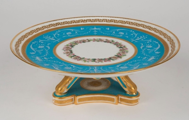 MINTONS fine antique English porcelain tazza with pate sur pate decoration on blue celeste ground, enamel floral garlands, and gilded highlights, 19th century, green factory mark to base, 9cm high, 24cm diameter