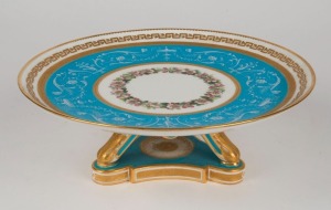 MINTONS fine antique English porcelain tazza with pate sur pate decoration on blue celeste ground, enamel floral garlands, and gilded highlights, 19th century, green factory mark to base, 9cm high, 24cm diameter