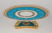 MINTONS fine antique English porcelain tazza with pate sur pate decoration on blue celeste ground, enamel floral garlands, and gilded highlights, 19th century, green factory mark to base, 9cm high, 24cm diameter