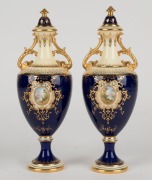 COALPORT&nbsp;pair of antique English porcelain blue and gilt vases, titles "ELLSMERE", and "ULLSWATER", painted by PERCY SIMPSON, early 20th century, green factory marks and titles to bases, ​​​​​​​22cm high - 2