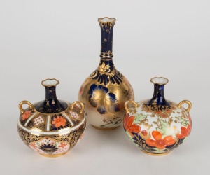 ROYAL CROWN DERBY group of three English porcelain stem vases, early 20th century, red factory marks to bases, the largest 15.5cm high