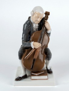 BING & GRONDAHL Danish porcelain statue of a cello player, 20th century, factory mark to base, 20cm high