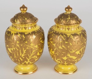ROYAL CROWN DERBY pair of antique English yellow porcelain lidded urns with gilt overlay decoration, 19th century, red crown and monogram marks to bases, 13.5cm high