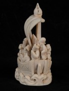 A Chinese carved ivory figural group in a boat, 19th/20th century, carved seal mark to base, ​​​​​​​12.5cm high - 2